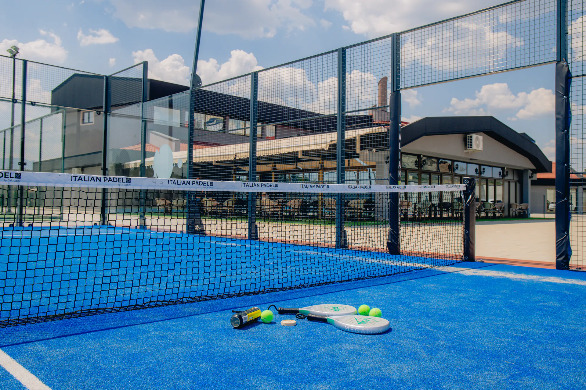 A padel court at Coconut, glassed in on every side